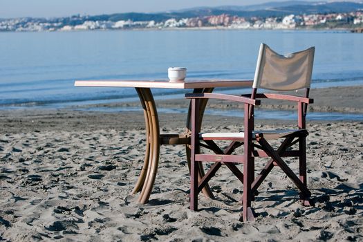 Empty Chair and Table on a  Beach, Spain