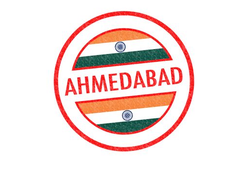 Passport-style AHMEDABAD (India) rubber stamp over a white background.