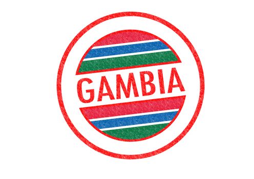 Passport-style GAMBIA rubber stamp over a white background.