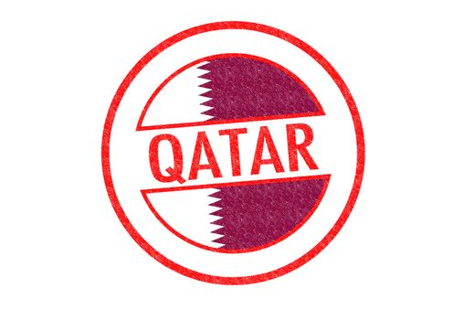 Passport-style QATAR rubber stamp over a white background.