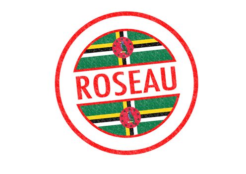 Passport-style ROSEAU (Dominica) rubber stamp over a white background.