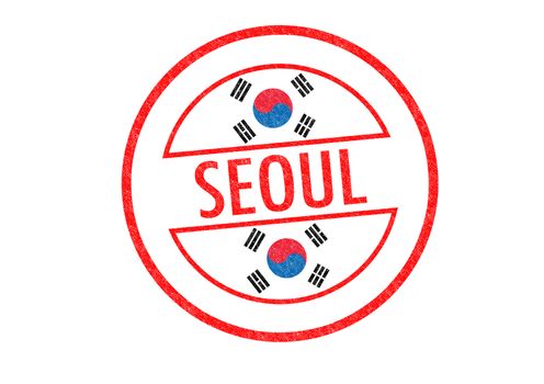 Passport-style SEOUL rubber stamp over a white background.