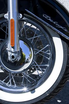 Motorbike's chromed engine. Bikes in a street