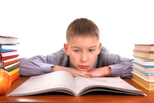 Bored and Tired Boy on the School Desk Isolated on the white background