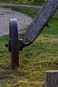 Old wagon wheels on a wooden column