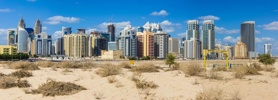 DUBAI, UAE - NOVEMBER 17: Midday heat in the desert in the background buildingsl on Nov 17, 2012 in Dubai UAE