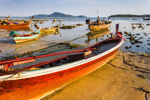 Fishing boats on the sea shore in Phuket, Thailand