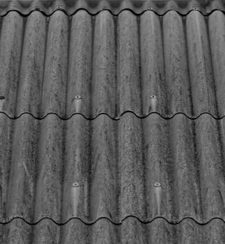 monochrome texture of gray corrugated slate roof