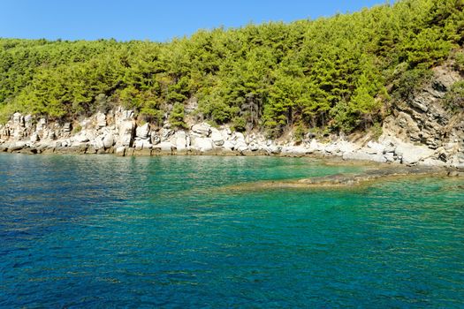 rocky beach with turquoise sea in greece thassos island