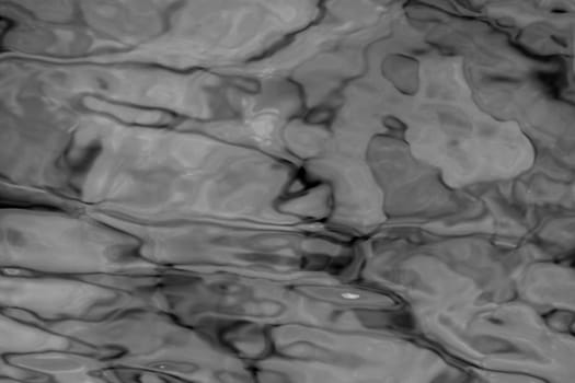 grey abstract background of wavy water surface