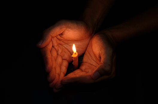 Candle light in hand, Hope concept