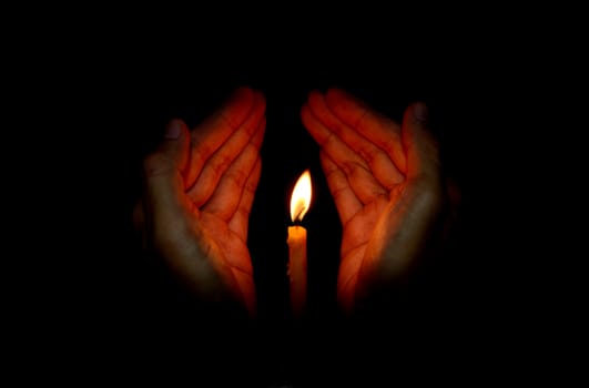 Candle light in hand, Pray concept