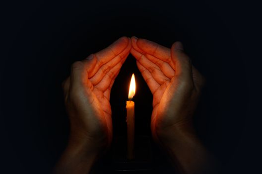Candle light in hand, Pray concept
