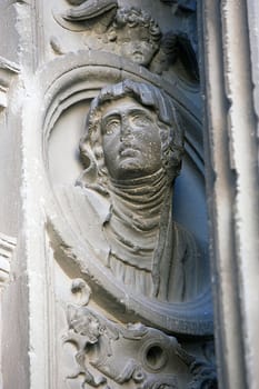 Tondo with woman's image in stone, relief of the Front of the chapel of El Salvador of Ubeda, Jaen province, Spain