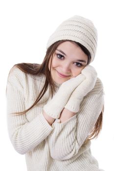 Pretty teenage girl in knitted mitten and hat isolated over white