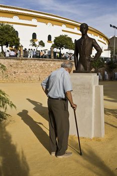 Man looking monument to the spanish bullfighter Manolete in Linares, Jaen province, Spain