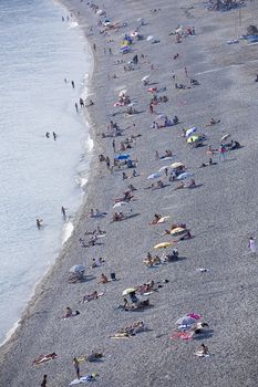 People enjoying the beach at Almunecar, Spain