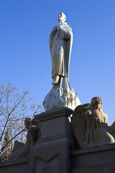 Sculpture of San Juan de la Cruz (poet and mystic of the Spanish renaissance) and two angels, square may 1, Ubeda, Jaen province, Spain