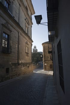 Real Street with bellfry at the background, paved street in historical center, Ubeda, Jaen province, Spain
