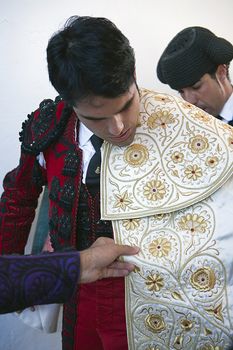 The spanish bullfighter Salvador Vega getting dressed for the paseillo or initial parade. Taken at Pozoblanco bullring before a bullfight, Pozoblanco, Cordoba province, Spain, 5 september 2010