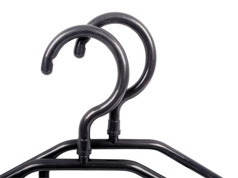 black hangers, upside parts of plastic black hangers isolated on white background