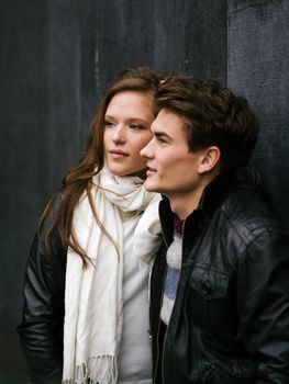 Photo of a happy couple in love outdoors during autumn.  Shallow depth of field with focus on the woman. Photo is from the PhotoWalk in Berlin during Microstock Expo.