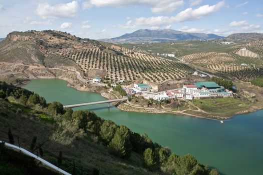 It was inaugurated on June 3, 1969, and belongs to the Guadalquivir hydrographic Confederation. The main tributary of the river Guadalquivir, the Genil, becomes Iznajar in the largest swamp in Andalusia.