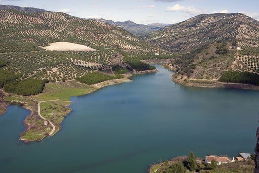 It was inaugurated on June 3, 1969, and belongs to the Guadalquivir hydrographic Confederation. The main tributary of the river Guadalquivir, the Genil, becomes Iznajar in the largest swamp in Andalusia.