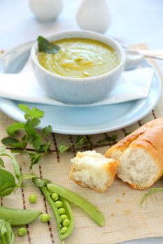 Delicious pea soup with fresh mint and crusty bread.