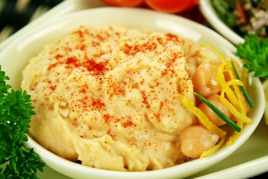 Hummus and chickpeas with lemon zest with paprika.