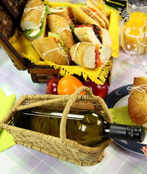 White wine, fruit and picnic rolls ready to serve.