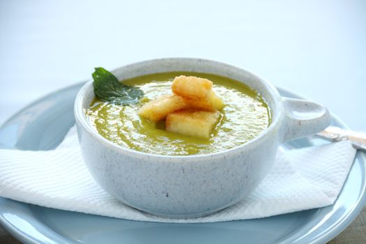 Delicious pea soup with fresh mint and ready to serve.