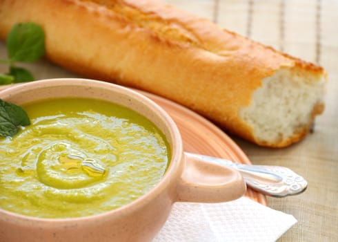 Delicious pea soup with fresh mint and crusty bread.