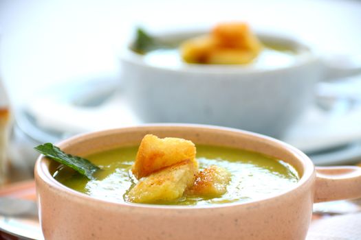 Delicious pea soup with fresh mint ready to serve.