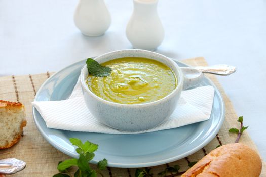 Delicious pea soup with fresh mint and crusty bread.