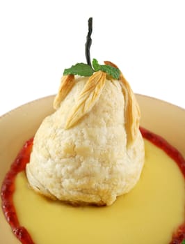 Delicious baked pear in sweet pastry on a bed of custard.