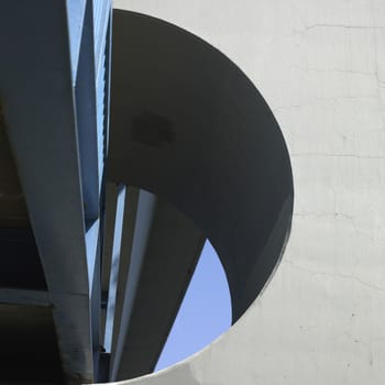 Blue aerial walkway with concrete wall