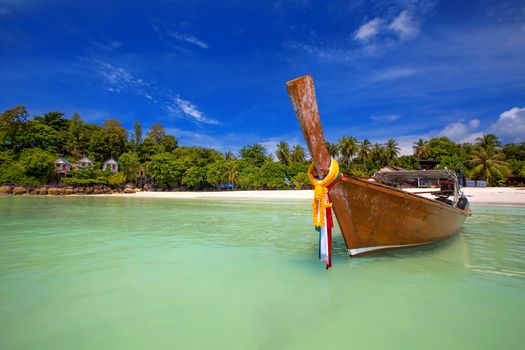 Longtaill boat and turquoise water at tropical beach