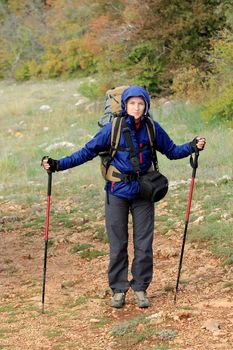 Tourist with backpacks go to the mountains
