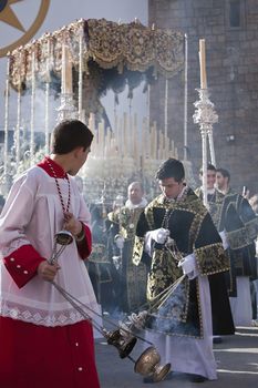 Young people in procession with incense burners in Holy week, Spain