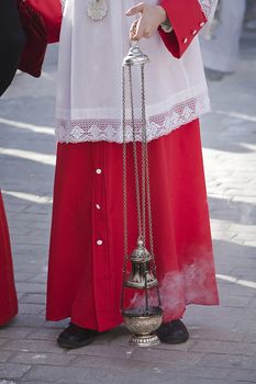 acolyte supports censer in a procession of Holy Week, Spain