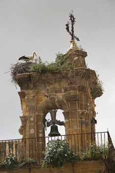 Stork on a Bell Tower of a church in Osuna, province of Seville, Spain