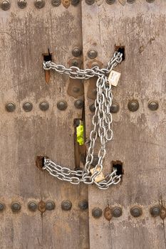 Door closed with chains, Osuna, Sevilla province, Spain