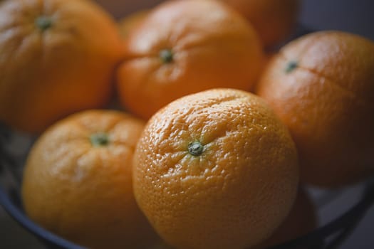 Some oranges in a bowl