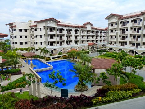 pool side view in a new low rise residential development offered for sale