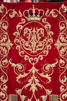 Embroidery thread of gold on red velvet, Spain