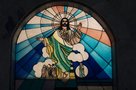 stained glass image of Christ taken in a public park