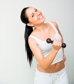 fitness woman working out with dumbbell