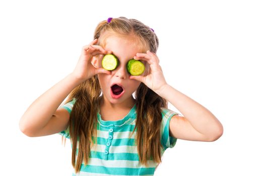 little girl with cucumber slices around the eyes isolated on white background