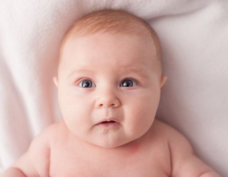 baby lying on the bed